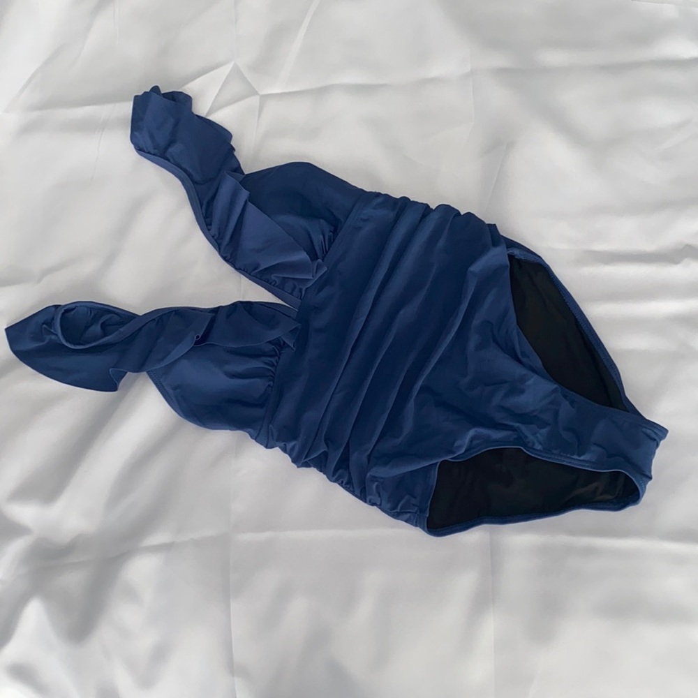 Small Blue one piece swimsuit with ruffle straps.